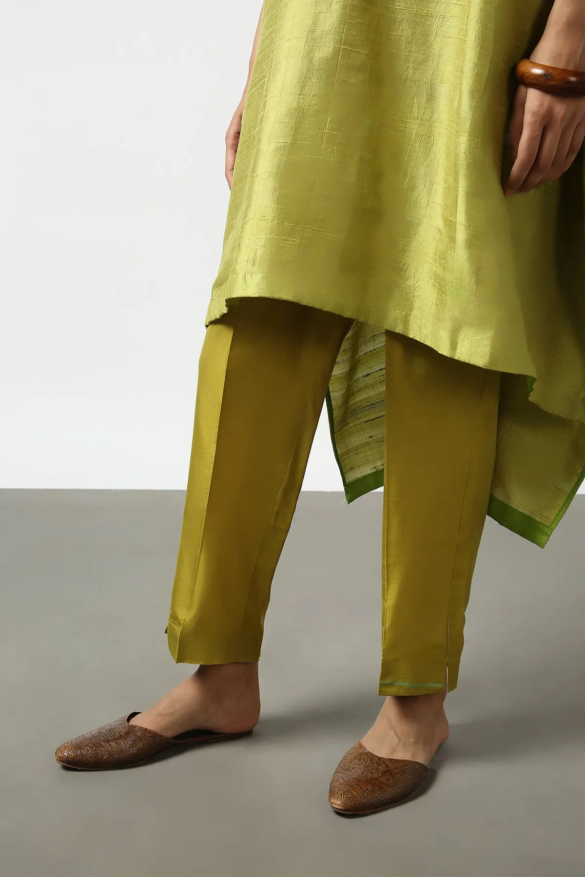 Green Raw Silk Top with Mirror Work Yoke. Tussar Pant or M. Giri Pant.